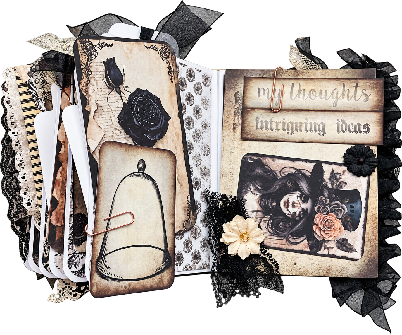 An ornate black, cream, and rose handmade journal by Rebecca Pool